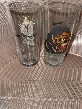 Ed Hardy Clear Pint Glasses with Black, Gold, Red and White Tattoo Graphics